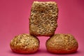 Vertical stack of bread pieces on pink background Royalty Free Stock Photo