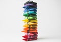 A vertical stack of Crayola and Prismacolor crayons arranged by color, from red at the bottom to Royalty Free Stock Photo