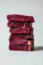 Vertical Stack of Raw Prime Beef Steaks on Minimalist White Background Royalty Free Stock Photo