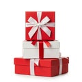 Stack of Three Red and White Gift Boxes Tied with Satin Ribbons on a White Background present Royalty Free Stock Photo