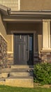 Vertical Stairs leading to porch and front door with sidelight at the entrance of home Royalty Free Stock Photo