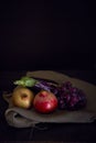 Vertical still life of eggplant and pomegranate Royalty Free Stock Photo