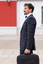 Vertical stock photo of an adult businessman walking down the street with his briefcase towards the office Royalty Free Stock Photo