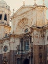 Vertical stock photo of the iconic Cathedral of Cadiz, Spain, illuminated by the afternoon light Royalty Free Stock Photo