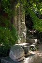 Stone worship stele and sculture. Japanese garden in Daifazu, Kyushu, Japan.