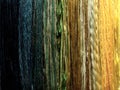 Close-up of Vertical Stripes formed by a Variety of Yarns in Deep Blue to Bright Gold Color Sequence, Background Image