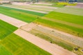 Vertical stripes of agricultural parcels of different crops. Aerial view shoot from drone directly above field Royalty Free Stock Photo