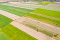 Vertical stripes of agricultural parcels of different crops. Aerial view shoot from drone directly above field Royalty Free Stock Photo