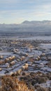 Vertical Sunset in Utah Valley with homes on a snowy neighborhood with mountain view