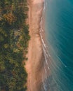 Vertical symmetric aerial view of a beach at a soft sunset