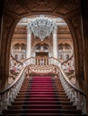 Vertical symmetrical shot of a palace's staircase with luxury decoration