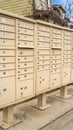 Vertical tall frame Residential mailboxes with numbered compartments on the side of a road