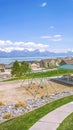 Vertical tall Houses and park with playground and picnic area on a neighborhood near a lake