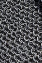 Vertical texture of metal chain mail. Royalty Free Stock Photo
