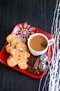 Vertical three Gingerbread men top view with coffee on red dish Royalty Free Stock Photo