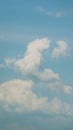 Unusual Clouds In Blue Sky. White Cloud On Blue Sky Background. Blue Sky Background With Tiny Clouds. Vertical Time Royalty Free Stock Photo