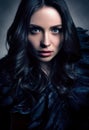 Vertical toned fashion portrait in dark tones. Beautiful young woman in black Royalty Free Stock Photo