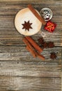 Vertical top view Cappuccino and cookie with star ansie and cinnamon stick Royalty Free Stock Photo