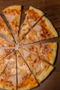 vertical top view closeup sliced pizza with prosciutto and pineapple Royalty Free Stock Photo