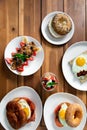 Vertical top view of different kinds of breakfast isolated on a wooden table Royalty Free Stock Photo