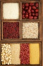 Vertical top view of a grocery wooden storage full of nuts and grains