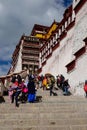 VERTICAL: Tourists walk up and down stairwell leading up to Potala Palace.