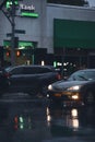 Vertical of a Toyota Camry on a rainy Brooklyn street at night, USA