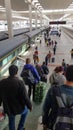 VERTICAL Travelers carry their luggage down flight of stairs to railway platform