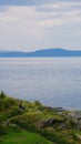 Vertical of Trondheim fjord cliff water and mountains