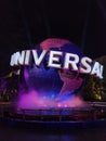 Vertical of Universal Studios Globe illuminated at night in Japan