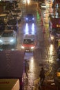 Vertical urban shot of a traffic in Sai Yeung Choi street on a rainy night in Mong Kok, Hong Kong Royalty Free Stock Photo