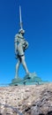 Vertical of the Verity sculpture at Ilfracombe harbour, Devon with a beautiful blue sky