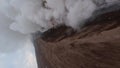 Vertical video. Active erupting volcano summit hot lava smoke stream extreme disaster