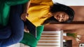 Vertical Video Asian woman checking webpages on tablet in hotel lobby