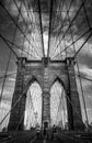 Vertical view from below of Brooklyn Bridge black and white