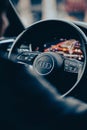 Vertical view of a black Audi car's steering wheel - vehicle interior