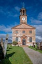 Vertical view of the building and cemetery stones of Kirkandrews under the blue sky in Carlisle