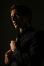Business man dressed in black suit portrait against a dark background. Closeup portrait handsome man, Royalty Free Stock Photo
