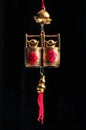 Vertical view of Chinese lucky golden trinket set over the black background Royalty Free Stock Photo