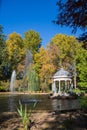 Vertical view of the Chinese pond with autumn trees, in the Jardin del Principe in Aranjuez