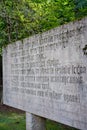 Vertical view of the concrete board with text in Salaspils memorials of somber Nazi prison-camp