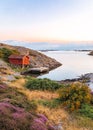 Vertical view of a cottage on the coast of a lake at sunset Royalty Free Stock Photo