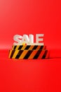 Vertical view of the 3D-rendered sale icon over the yellow-striped display