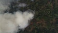 Vertical view, Dangerous wildfires. A lot of white smoke is due to forest fires in a tropical forests