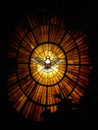 Vertical view of the dove of the Holy Spirit on the stained glass in St. Peter's Basilica Royalty Free Stock Photo
