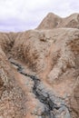 Vertical view with dramatic cracked slope. Dry land in natural p