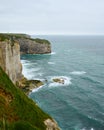 Vertical view of Etretat cliffs and turquoise Atlantic waves Royalty Free Stock Photo