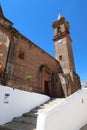 Vertical view. Facade and bell tower of the church of the Holy Spirit of Fuenteheridos, Huelva, Spain