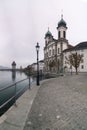 Vertical view of the famous Swiss city of Lucerne cityscape skyline and Kappel bridge with water tower and Jesuit church under an