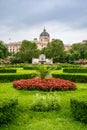 Vertical view of the Franz Grillparzer Monument surrounded by ViennaÃ¢â¬â¢s green, lush Volksgarten, (